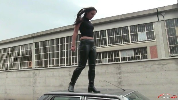 188 : Miss Iris jumping and stomping on the hood and roof of the Lancia Prisma