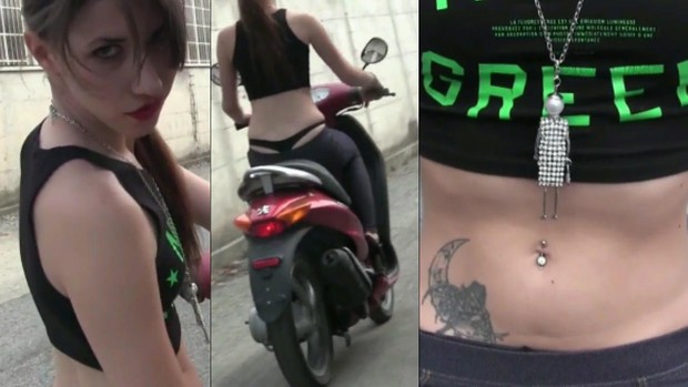 198 : Miss Black Mamba revving, bouncing and driving the Peugeot scooter