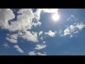 00216_GoPro Hero 4 footage blue sky with white puffy clouds time lapse