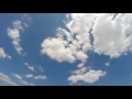 00228_GoPro Hero 4 footage blue sky with white puffy clouds time lapse