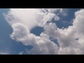 00208_GoPro Hero 4 footage blue sky with white puffy clouds time lapse