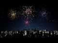 00296_colorfull fireworks over city night sky seamless loop animation
