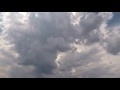 00209_GoPro Hero 4 footage blue sky with white gray puffy clouds time lapse