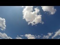 00267_GoPro Hero 4 footage blue sky with white puffy clouds time lapse