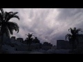 00201_desert ruins with cloudy rainy sky and date palm trees CGI composition