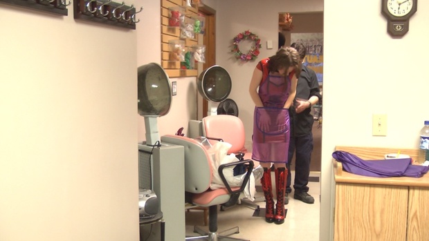 Gal in Vinyl Dress trying on 15 Capes and Aprons - VOD Video on Demand