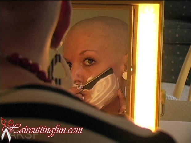 Woman shaving her face straight-edge razor